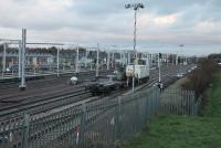 New main line tracks have been laid alongside Blackpool Depot, as seen here on 9th December 2017. The rail vehicles in the foreground are the <I>match wagon</I> for the self propelled crane working in the station throat and another support vehicle. [See image 61832] for the same location less than three weeks earlier, since when the gantries on the depot sidings have also advanced considerably.  <br><br>[Mark Bartlett 09/12/2017]