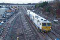 The new layout at Kirkham North Jct can be seen in this view to the west on 09 December 2017. On the right is the Up Blackpool, then the Down Blackpool with track plant. The Up South Shore joins this line beyond the road bridge. Next is the Down South Shore and finally what appears to be a single engineers siding to replace several that have been removed. Now the track is in place perhaps the OHL masts will start to appear.<br><br>[John McIntyre 09/12/2017]