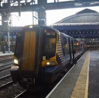 Electric unit 380113 at Glasgow Queen Street High Level having run through from Edinburgh <i>via Falkirk</i>.<br><br>[John Yellowlees 10/12/2017]