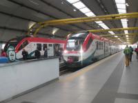 Fiumicino Airport Rome with the recently arrived 0805 Leonardo Express from Rome Termini while the 0853 return jouney awaits its departure. On the right a local stopping train waits to leave from Platform 3. (02/12/17)<br>
<br><br>[Alastair McLellan 02/12/2017]