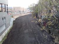 The curve between London Road Junction on the Abbeyhill loop and Easter<br>
Road Junction Behind me) allowed trains from Waverley to reach Granton<br>
without being hauled up Scotland Street tunnel. I believe it fell out of<br>
use in the late 1980s and was lifted some time afterwards. The area is<br>
being developed over a period of years, and London Road Junction site (in<br>
distance) is currently inaccessible, as is the trackbed here. It was<br>
thoroughly overgrown until quite recently; it looks like a temporary road<br>
has been created for plant. 3rd December 2017. [Granton Shell sidings closed in 1980 and, following a period of being mothballed for possible gasworks traffic, Granton-Powderhall was lifted 1986. So why did this curve survive, for turning engines?]<br>
<br><br>[David Panton 03/12/2017]