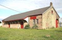 The old goods shed at Wooler, photographed from the A697 on 24 October 2006. The building had recently been taken over by an antiques dealer. [See image 47596]<br><br>[John Furnevel 24/10/2006]