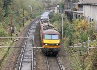 90028 and a DBS stablemate begin the climb of the Ripley bank south of Lancaster station with the double headed Mossend to Daventry container train on 31st October 2017. Note the double banner repeater signal on the down side, giving an early indication of the signal that controls the Down fast and platform lines outside Castle station. <br><br>[Mark Bartlett 31/10/2017]