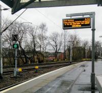 The 'N' on the toy signal at the south end of Cathcart station indicates<br>
thet the road is set for a Neilston train - which is just as well. Coming<br>
in from the left is the Newton line, used by trains which are going via<br>
Maxwell Park and therefore (just) avoiding Cathcart. So close and yet no<br>
platforms (nor have there ever been, so far as I know). Alternate Newton<br>
Trains go via Queens Park and take the North Junction, well clear of the<br>
station.​​<br>
<br><br>[David Panton 06/12/2017]