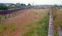 To the south of Dyce, on the west side of the line, was an extensive carriage shed and yard. By 1989 only this loading bank remained. Now not even this exists as the site has been redeveloped.<br><br>[Ewan Crawford //1989]