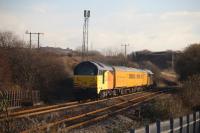 Colas 67027, on the rear of the Network Rail Test train as it climbs up Stormy Bank towards Pyle on 8th December 2017. This was an Old Oak Common to Swansea test run returning to Derby and is passing Water Street Jct, which was the entrance to Margam Yard Reception Sidings. [Ref query 12 December 2017]<br>
<br>
<br><br>[Alastair McLellan 08/12/2017]