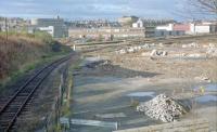 View of Kittybrewster in 1989. Oil sidings here had been lifted and the site was being redeveloped. <br>
<br>
Kittybrewster [1st], on the line down to Waterloo, was close to the camera and Kittybrewster [2nd], on the Denburn Valley line, was beyond on the main line. Before these, the first station here was a terminus called Aberdeen Kittybrewster.<br>
<br>
David Spaven comments 'there was a major domestic coal terminal here, served by hopper wagons. I was the Speedlink Coal manager responsible for shifting the coal handling activity down to Guild Street, immediately adjacent to the Russell (ex Freightliner) intermodal terminal, with coal arriving from Yorkshire and South Wales by container. The Baker Atlas for 1988 shows Ellis & McHardy Coal Depot, Lime and LPG Terminals.'<br>
<br><br>[Ewan Crawford 03/11/1989]