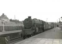 A Dumfries - St Enoch train calls at Sanquhar on 16 July 1961 behind Black 5 45010. <br><br>[G H Robin collection by courtesy of the Mitchell Library, Glasgow 16/07/1961]