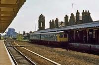 A Cravens/Gloucester hybrid DMU forming an Ipswich to Cambridge service calls at Bury St Edmunds on 29th May 1978. The wide gap between the platforms was the legacy of the original track layout by which, until the 1960s, both platforms were served by side loops off a central double tracked main line.<br><br>[Mark Dufton 29/05/1978]