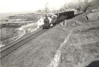 Ex-GNSR 4-4-0 62265 climbs away from Banff with a two-coach train in the summer of 1956. <br><br>[G H Robin collection by courtesy of the Mitchell Library, Glasgow 03/08/1956]