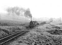 An internal NCB coal train from Minnevey Colliery passing Burnton Loop on the Waterside complex in 1972 just west of Minnivey, with the shunter riding side-saddle.<br><br>[John Furnevel 04/03/1972]