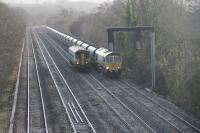 Arriva Trains Wales Cardiff to Llanelli Class 153 single unit, passing 66562 on a Barrow Hill to Port Talbot Grange Sidings loaded coal train at Miskin. 14th December 2017<br>
<br>
<br><br>[Alastair McLellan 14/12/2017]