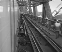 Rail renewals on the Forth Bridge Up line in 1983. In time, 'bridge rail' was replaced by standard profile. <br>
<br>
<br><br>[Bill Roberton //1983]