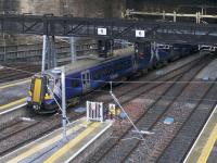 380020 departs from Platform 4 at Queen Street on the third day of partial introduction of electric services on the Glasgow to Edinburgh via Falkirk route - 12th December 2017.<br><br>[Colin McDonald 12/12/2017]