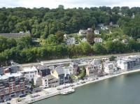 There are some really nice old buildings in Dinant, but the flat roofed concrete station is not one of them. It does however have a good service of trains and is seen here from the ramparts of the Citadel, high above the old town, on 6th September 2017. A Class 08 EMU waits in a platform before proceeding north to Brussels Airport. <br><br>[Mark Bartlett 06/09/2017]