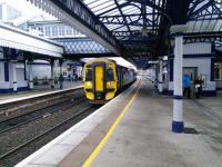 A Dunblane service calls at Stirling on 5th December 2017. It is somehow hard to<br>
imagine electrics here but that is the plan for 2019. It will require some alteration of the canopies, though I read that the footbridge above the train here will be retained, needing only to be jacked up a bit. However the fine footbridge between Platforms 6 and 9 will have to be replaced by an accessible one, and we all know what that means.<br>
<br>
<br><br>[David Panton 05/12/2017]