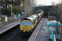 FreightlinerHeavy Haul 66562, on a Barrow Hill to Port Talbot Grange Sidings loaded coal train, passes through Pontyclun station on 14th December 2017.<br>
<br>
<br><br>[Alastair McLellan 14/12/2017]