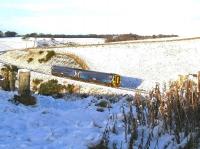 The late running ScotRail 1324 Edinburgh Waverley - Tweedbank passes through the remnants of a Boxing Day snowfall at Fallahill Summit on 27 December 2017.<br><br>[John Furnevel 27/12/2017]