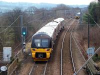 333001 pulls away from Ben Rhydding with an Ilkley to Leeds service as 333012 approaches with another Wharfedale line service from Bradford to Ilkley on 19th December 2017. <br><br>[Mark Bartlett 19/12/2017]