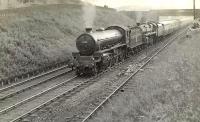 B1 61134 pilots Standard class 5 73077 with a train on Cowlairs Incline in June 1957. <br><br>[G H Robin collection by courtesy of the Mitchell Library, Glasgow 21/06/1957]