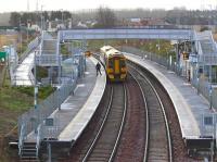 <I>'It can be a lonely job at times...'</I> Looking south over Shawfair station on a grey and cloudy 18 December 2017, with the 1009 ScotRail service to Tweedbank recently arrived. The lone figure on platform 2 is the guard, who has just discovered there are 'no takers' for his train this morning.<br><br>[John Furnevel 18/12/2017]