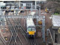 The 0956 ex-Helensburgh Central runs past the old west box and on towards Waverley's platform 9 on 21 December 2017.  In the background (left to right) are the 1133 to Ayr via Carstairs and Glasgow, the 1150 to Helensburgh Central and the terminated 0615 from London Kings Cross.<br><br>[John Furnevel 21/12/2017]