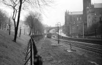 A diverted service heads towards Inverness, passing the closed Schoolhill station in Aberdeen in April 1975.The remains of the former Great North loco sidings are to the right of the fence. [Ref query 31 December 2017]<br><br>[John McIntyre 12/04/1975]