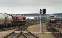 66070 waits to leave Aberdeen with cement empties as a HST passes.<br>
<br>
<br><br>[Bill Roberton //2000]