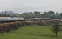 A pair of Voyagers, on 9S47 New St to Glasgow, meet a Pendolino working 1M09 Glasgow to Euston on the embankment at Bay Horse. 29th December 2017. <br><br>[Mark Bartlett 29/12/2017]