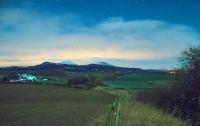 A night-time view looking north over the site of Charlesfield Halt towards the Eildon hills. See image [[58394]].