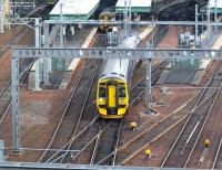 A 158 leaves Waverley platform 17 on 21st December 2017 with the 1150 to Glenrothes with Thornton. In the background at platform 18 is another 158 with the 1210 scheduled departure to the same destination.<br><br>[John Furnevel 21/12/2017]