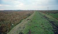 View west on the North Monkland Railway. The location is close to the former Longriggend Remand Institution. Going west the North Monkland crossed over the extension of the Dykehead Branch before serving the Brownrigg Colliery.<br>
<br>
Much of the North Monkland line passed through bleak high moorland.<br><br>[Ewan Crawford //2001]