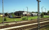 DB Class 216 and 218 diesels sit outside the loco shed at Kempten in southern Germany in June 1990. Photographed from a train approaching the station which is out of view to the right.<br><br>[John McIntyre /06/1990]