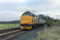 A good start to 2018. 37403 <I>Isle of Mull</I> accelerates away from the Arnside stop with 2C47 Preston to Barrow on New Year's Day morning 2018, with the growl from the engine audible all the way to Grange-over-Sands. The DRS contract with Northern is scheduled to run until January 2019 but there is speculation that Class 37 use may end with the start of the 2018 summer timetable. <br><br>[Mark Bartlett 01/01/2018]
