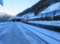 EC163 Zurich to Graz departs St Anton heading towards Innsbruck, next stop Landeck, on 23rd December 2017. The coach is an SBB Gotthard Express Panorama vehicle.<br>
<br>
<br><br>[Alastair McLellan 23/12/2017]