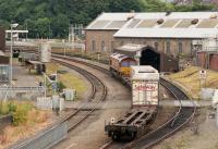 An EWS Class 66 passes Inverness Depot with the Safeway intermodal service from Georgemas Junction in 2000.  A DRS-operated train for Tesco is now being mooted.<br>
<br>
<br><br>[Bill Roberton //2000]