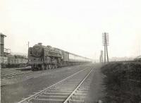 BR light Pacific 72006 <I>Clan Mackenzie</I> passing the coaling stage at Balornock shed on 14 March 1956 on its way to Buchanan Street with the up <I>'Saint Mungo'</I>.<br><br>[G H Robin collection by courtesy of the Mitchell Library, Glasgow 14/03/1956]