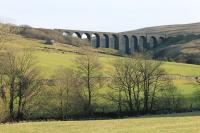 Situated on the east side of Dentdale, mid way between Dent Station and Dent Head Viaduct, this is Arten Gill Viaduct, nicely lit by the winter sun on 27th December 2017. The River Dee runs in the foreground. <br><br>[Mark Bartlett 27/12/2017]