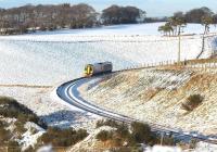 An afternoon service on the Borders Railway rounds the curve approaching Falahill on 27 December 2017.<br><br>[John Furnevel 27/12/2017]