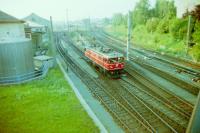 Austrian electric Bo-Bo 1043 009 3 passing Salzburg marshalling yard in 1988.<br><br>[Gordon Steel 18/08/1988]