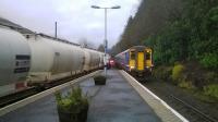 On 5th January 2018 Scotrail 156477 arrives at Arrochar and Tarbet with a train for Oban passing a GBRf Class 66 awaiting clearance for its onward journey hauling empty alumina tanks from Fort William to North Blyth.<br><br>[Malcolm Chattwood 05/01/2018]