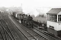 Bucksburn seen from the south of the station. Class 4MT 76104 flagged to halt circa 1961. [Ref query 9 January 2017]<br><br>[David Murray-Smith //1961]