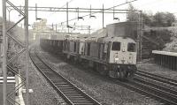 Double headed Class 20s, with 20123 leading, passing Uddingston Junction in the 1970s with iron ore empties from Ravenscraig Steel Works heading for General Terminus Quay via Strathbungo Junction. One or two further Class 20s would join the train at Strathbungo for the final part of the journey to the quay. [Ref query 10 January 2017] <br><br>[Ian Millar //]