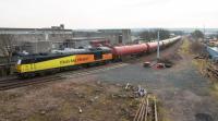 60047 with the empties from Dalston passing the site of the former Grangemouth station, just awaiting the will to re-open it. With the reduction in trackwork there's plenty of spare room here.<br><br>[Ewan Crawford 12/01/2018]