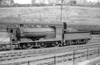 Resident J35 0-6-0 64494 photographed in the shed yard at Hawick in 1958. Standing just beyond on the adjacent road is shedmate J36 0-6-0 65317.<br><br>[Robin Barbour Collection (Courtesy Bruce McCartney) //1958]