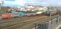 A view to the north east from the footbridge at Trondheim Sentralstasjon showing two of the passenger platforms in the foreground. The harbour railfreight terminal dominates both the scene and the amount of rail traffic. Many and varied container trains can be seen including public post by Posten (Norwegian) and Postnord (Swedish/Danish) and private sector parcels carrier Bring, retail goods for Spar shops as well as a military train carrying tracked vehicles one of which later that day fell off its wagon! see https://www.globalrailnews.com/2017/11/10/tank-removed-from-railway-line-in-norway/<br>
 A couple of harbour shunters with chequered yellow and black nose bands are visible as a well as a Green Cargo RC4 AC electric loco visiting from Sweden. Photo K .Johansson<br><br>[Charlie Niven 26/10/2017]