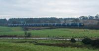 Westbound electric on the Edinburgh and Glasgow viewed from the Greenhill Lower bridge.<br><br>[Ewan Crawford 12/01/2018]