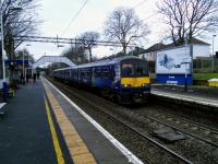 ​​A half-hourly Cumbernauld to Dumbarton Central EMU calls at Scotstounhill on 13th January 2018. These services alternate with Whifflet/Motherwell to Dalmuir trains while non-stoppers whoosh through in between.<br>
<br>
<br><br>[David Panton 15/01/2018]