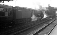 The 11am to Glasgow St Enoch preparing to leave Carlisle platform 3 on Saturday 7 March 1964. The locomotive is Polmadie Standard class 5 4-6-0 no 73059.<br><br>[K A Gray 07/03/1964]