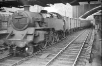 A freight runs south through Aberdeen station in the summer of 1958.<br><br>[Robin Barbour Collection (Courtesy Bruce McCartney) 29/07/1958]